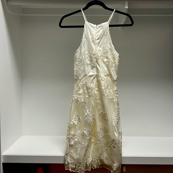 Brand is Mystic from LA, cute off white lace overlay with a sexy hemline - Picture 2 of 2